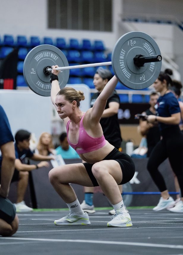 Olivia lifting in a CrossFit competition